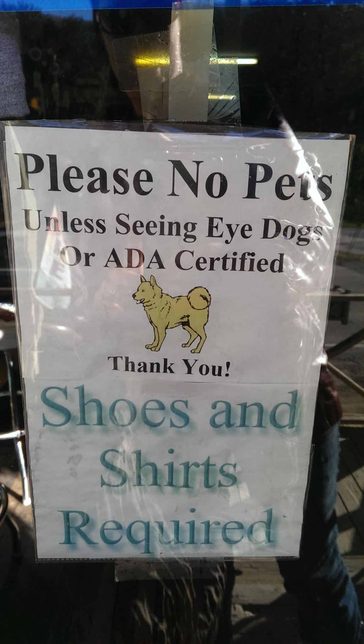 An incorrectly-worded service dog sign ("Seeing Eye Dog or ADA certified")